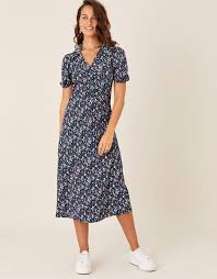 The textural knit is engineered to fit and flare with a round neck, contoured shoulders and full, twirlable hem. Floral Print Jersey Midi Dress Black Work Dresses Monsoon Global