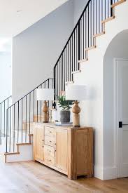 Modern Farmhouse Foyer Features A Custom Staircase With Wrought Iron Stair Railing Home Bu Wrought Iron Stair Railing Modern Staircase Modern Farmhouse Foyer