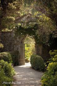 This Beautiful Formal Garden Is Enclose By An Old Handsome Tall Brick Wall It Has A An Arched Opening For The Gate Beautiful Gardens Secret Garden Dream Garden