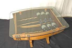 Handsome style and ultimate functionality combine in this exclusive wine barrel furniture collection. The Griffiths Barrel Coffee Table Wine Rack 14 Bottle The Fine Wooden Article Company