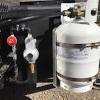 Travel trailer propane tank holder. 1