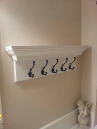 If your mirror is already attached to the wall, you could still create a mirror frame out of crown molding without having to pull said mirror out. Crown Molding Shelf Diy Storage Bathroom Diy Storage Crown Molding Shelf