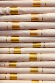 Kerala kasavu brocade settu mundu with 4 inch colour and golden stripe horizontal border gives the royal rich effect. Kerala S White And Gold Kasavu Saris History And Significance Of The Traditional Weave Vogue India