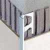 The reveal forms a square corner along the outside edge of the tile. 1