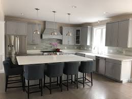 A contrasting kitchen island is a great way to inject color repeating colors will help blend a contrasting kitchen island into the overall design. Gray Kitchen Cabinets With White Quartz Island And Countertops Stone Backsplash And Nav Grey Kitchen Cabinets Grey Quartz Kitchen Countertops Stone Backsplash