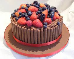 Chocolate Fudge Cake Topped With Fresh Mixed Berries And Surrounded By Chocolate Fingers Chocolate Finger Cake Cake Chocolate Day