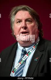 Assistant general secretary at Unite union Howard Beckett during a mass  meeting, organised by Unite, to discuss their next step in the row over  jobs and conditions amid warnings that legal and