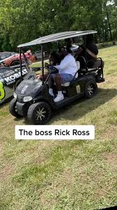 Rick Ross at his house riding his golf car checking out the car coming for  his first car show at his crib.#dkyrecords