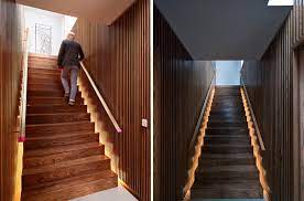 stairs with hidden lighting on either side create a dramatic effect when reflected off the wood slat walls hidden lighting stairs modern stairs