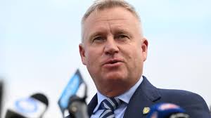 NSW Premier Chris Minns' father in induced coma in hospital after suffering  heart attack