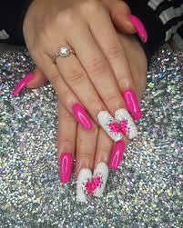 These ombre style nails are painted in hot pink and various designs are added such as a heart, dots, stripes, and others. Updated 45 Sparkling Nails With Diamonds August 2020