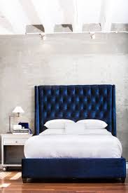 Although upholstered headboards have been riding high on the decorating charts for some time now, that doesn't mean that wooden headboards have lost their luster. Home Industrial Elegant Design Wendy S Lookbook Remodel Bedroom Master Bedrooms Decor Blue Headboard