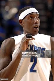 Robert Sallie of the Memphis Tigers drives to the basket past Nick... News  Photo