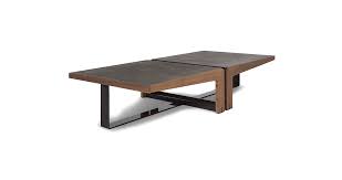 Starting with a sandblasted teak frame, artisans wrap the bottom shelf of the table in metal for a chic contrast. Dalton Phoenicia Decor