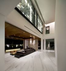 The double height entrance hall design gives a feeling of openness and brings in fluidity into the atmosphere. Double Volume Main Living Space The Green House K2ld Architects Singapore Luxury House Designs Modern House Design House