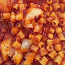 Kusksu (libyan couscous with spicy beef and vegetables. Pasta With Garbanzo Beans Potatoes In A Spicy Tomato Sauce Mbakbaka Libyan Food Spicy Tomato Sauce Garbanzo Beans