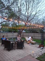 The Happy Homebodies Diy Stringing Patio Cafe Lights Patio Lighting Backyard Cafe Outdoor Patio