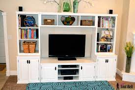 So, after i attached the doors, i painted the main console with behr cozy cottage (satin) and i stained the top boards with minwax dark walnut! Remodelaholic Pottery Barn Media Center Building Plans