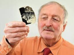 Jack Dreher spots himself in the Manchester Evening News celebrating VE Day  in Harpurhey