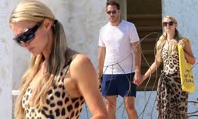 Hilton and the venture capitalist, also 40, got engaged in february after dating for a year. Paris Hilton Hangs By The Pool With Beau Carter Reum In Mexico Paris Hilton Leopard Swimsuit Paris