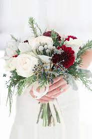 We've rounded up 10 beautiful, whimsical winter wedding bouquets to inspire your floral designs. Stunning Winter Wedding Bouquets See More Http Www Weddingforward Com Winter Wedding Bouq Winter Wedding Bouquet Bridesmaid Flowers Winter Wedding Flowers