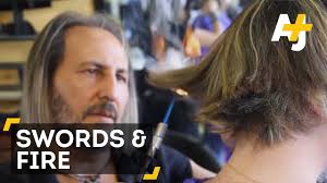 At the 'alberto olmedo' salon in campamento, south madrid, olmedo uses medieval techniques to he claims that his approach is inspired by renaissance tradition and swords enable a hairdresser to. Watch This Medieval Hairstylist Cut People S Hair With Swords And A Blowtorch Gq