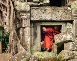 Travelers interacting with a local community in a village in Cambodia.
