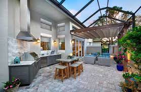 The dappled sunlight created by the overhead latticework creates a cool, relaxing environment perfect for backyard entertaining—like standing in the shade of a tree on a hot summer day. 8 Outdoor Kitchen Design Trends For Southwest Florida Home