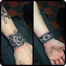 12 Classy Cuff Tattoos Cuff Tattoo Traditional Tattoo Cuff Wrist Tattoos For Guys