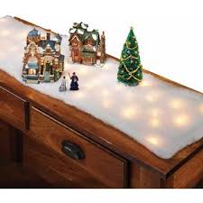 Create an artificial snow carpet with our fake snow blanket rolls. Fox Valley Traders Lighted Snow Table Runner Illuminated Blanket Of Artificial Snow For Christmas Village Display White 45 Long X 13 Wide