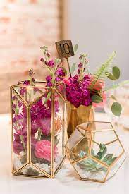 Most weddings feature gold decor in modern to start, you can learn how to make a terrarium so you can create fun and fresh geometric table decor. 14 Geometric Wedding Table Decor Ideas The Bohemian Wedding Unique Wedding Centerpieces Terrarium Wedding Geometric Terrarium Wedding
