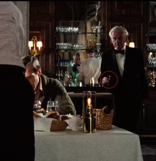 In "My Dinner with Andre" (1981) the waiter wanted to serve the amaretto  before it was ordered. Then he finally serves it after Wally gives his  speech about the future/science/omens etc. :