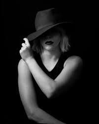 High Contrast Black And White Female Portrait Woman With Hat Face Partially Obscured By Shadow Black And White Portraits Portrait Insta Image