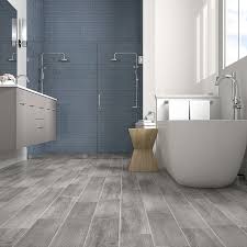 Style Selections Woods Vintage Gray 6 In X 24 In Glazed Porcelain Wood Look Floor Tile Lowes Com In 2020 Wood Tile Bathroom Wood Tile Bathroom Floor Gray Wood Tile Flooring