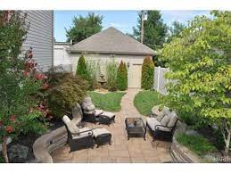 Installing a floor drain in your detached garage slab is a great idea. When You Have A Detached Garage And A Small Space For Entertaining Outdoors This Is Sophisticated Cozy Outdoor Living Small Backyard Backyard