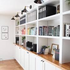 Use pocket holes to secure the cleat at the back of the cabinet. Diy Built In Bookcases
