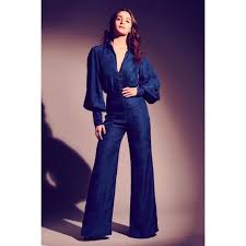 Siren red women's bootcut jeans with a matching cropped denim jacket and black bandeau. Bell Bottoms Back In Vogue