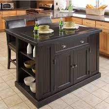 Bring crafted of solid hardwoods, the kitchen island base showcases beadboard paneling, brushed nickel hardware, and a stately plinth base. Home Styles Nantucket Kitchen Island With Black Granite Inlay And Breakfast Bar In Distressed Black Or White Kitchensource Com