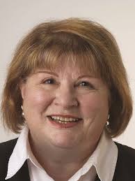 Commissioner candidate announces husband's death