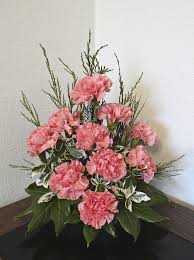 Pink Carnations With Some Fir Branches And Fatsia Leaves This Type Of Fl Artificial Flower Arrangements Fresh Flowers Arrangements Church Flower Arrangements