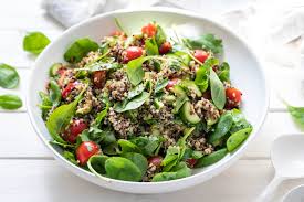 Use cooked quinoa as a simple healthy side dish, in a salad or as a base for a delicious main dish. Quinoa Salad With Tomato Cucumber Spinach Recipe Elle Republic