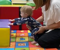Wondering when your little munchkin is ready to sit up on their own? Pulling To Stand Using Furniture Therapies For Kids