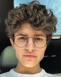 The mullet makes a very distinguished comeback in this very look. Vasiliki Halastaras On Instagram Androgynous Hair Curly Hair Men Short Curly Haircuts