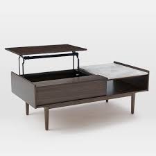 It features a warm oak finish and a classic and elegant design that fits in almost any living room. Buy Online Mid Century Pop Up Storage Coffee Table Now West Elm Uae