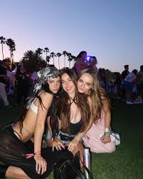 Charli DAmelio rocks sheer dress and combat boots to Coachella 2024