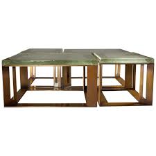 Square coffee table, wooden top, leather base, polished stainless steel details. Set Of Four Biennale Tables By Robert Marinelli Los Angeles Usa 2019 At 1stdibs