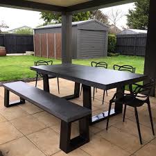 The table top and both bench seats are crafted from manufactured wood for a sophisticated contrast. Polished Concrete Dining Table And Bench Seat Patio Alfresco Etsy