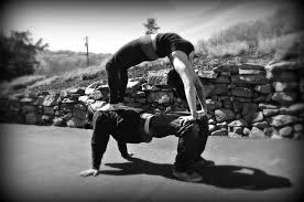 Urdhva Dhanurasana On Top Of Purvottanasana Partner Yoga Pose Partner Yoga Partner Yoga Poses Couples Yoga