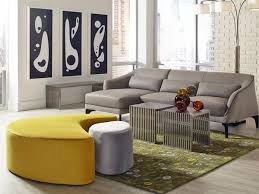 The oversized ottomans for your coffee tables are: Rent The Intersect Yellow And Gray Ottoman Cort Furniture Rental