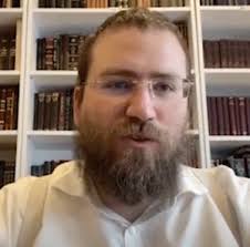 Henry Greener talks with Rabbi Eli Feldman